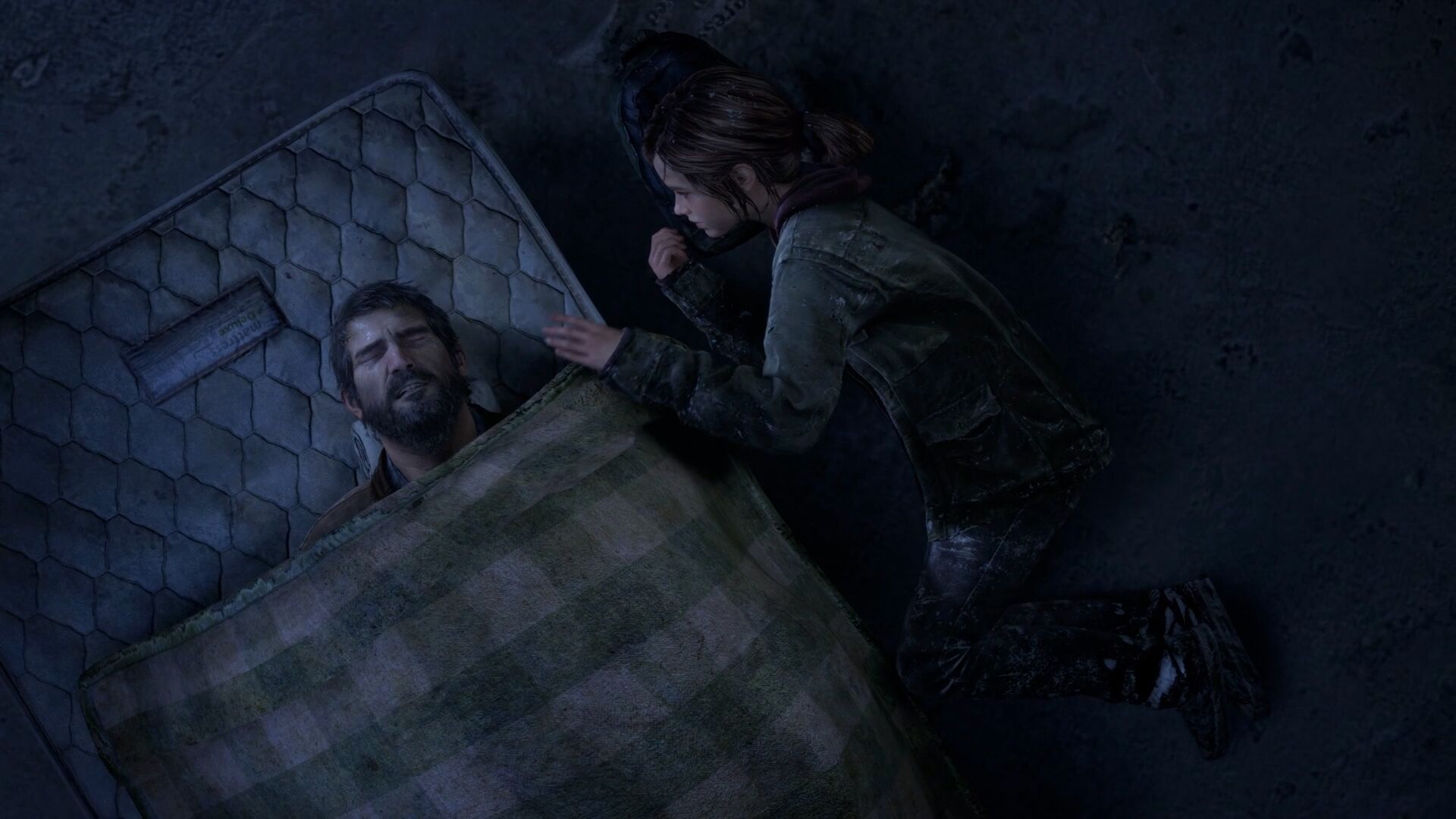 A still from The Last of Us video game depicting a weary Joel resting on a worn mattress, with Ellie kneeling beside him, seemingly checking on him; a somber scene in a dimly lit, cold environment.